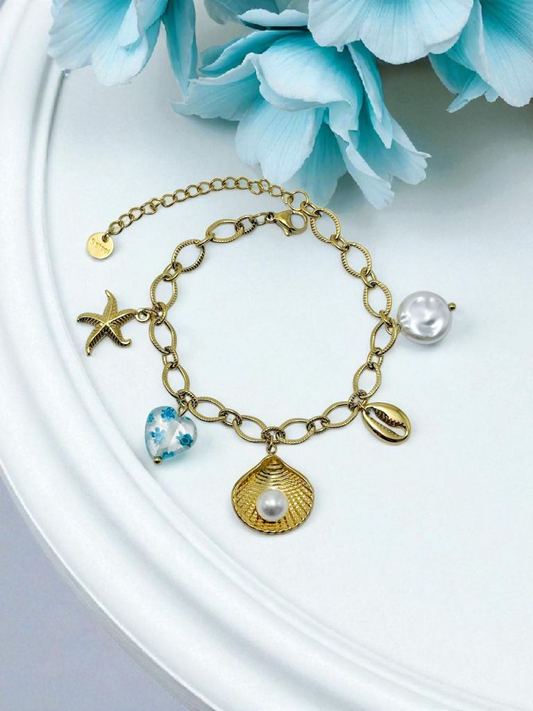 Bracelet chaîne dorée breloques de la mer bleues