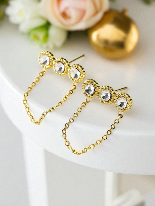 Boucles d'oreilles dorées triple strass avec chaîne