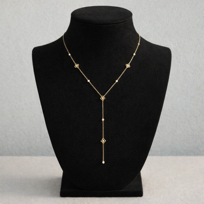 Collier doré en Y orné de petites fleurs et strass